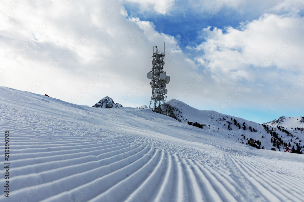 A transmitter at the top of a mountain in the Dolomites ski area. Empty ski  slope in winter on a sunny day. Prepare ski slope, Alpe Cermis, Italy Stock  Photo | Adobe