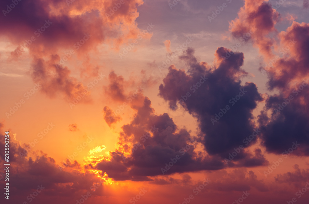 Tropical Sunset or sunrise with clouds, light rays and other atmospheric effect