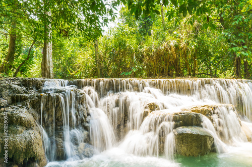 Tad Kwang Si (Xi) the biggest water fall land mark in Luang Prabang, Laos ,beautiful turquoise color water at tropical forest in north Lao, for use as a background or travel advertisement image