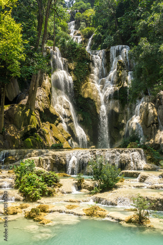 Tad Kwang Si (Xi) the biggest water fall land mark in Luang Prabang, Laos ,beautiful turquoise color water at tropical forest in north Lao, for use as a background or travel advertisement image