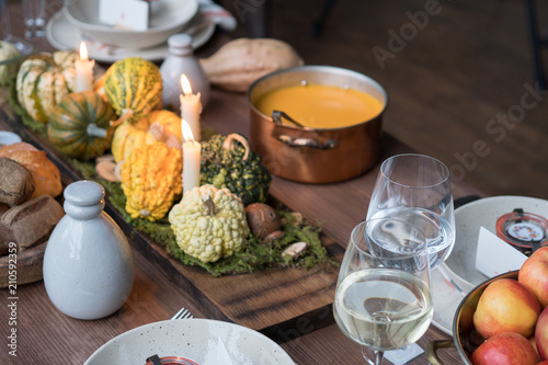 Autumn table setting with pumpkins. Thanksgiving dinner and fall decoration.