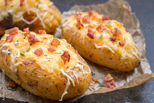 Photography Baked loaded potato with bacon, cheese and onion