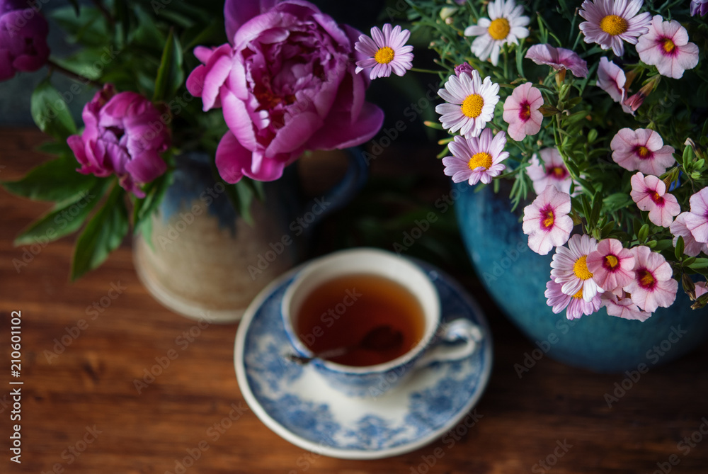 Flowers and Cup of tea at summertime Flowers and Cup of tea at summertime