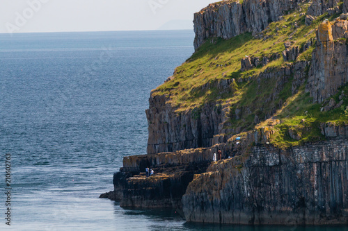 Dramtic coastline scenery consisting of arches and limestone cliffs (West Wales) photo