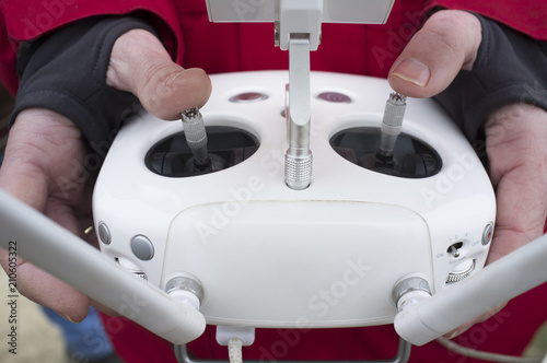 Right control stick for throttle. Pilot maneuver dron on remote controller