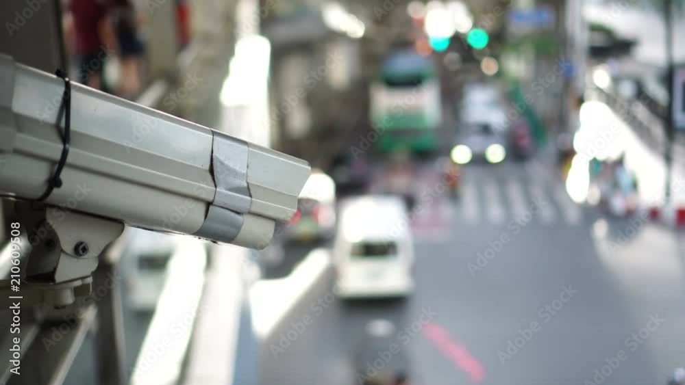 City cctv surveillance over street, people and public traffic video 4k