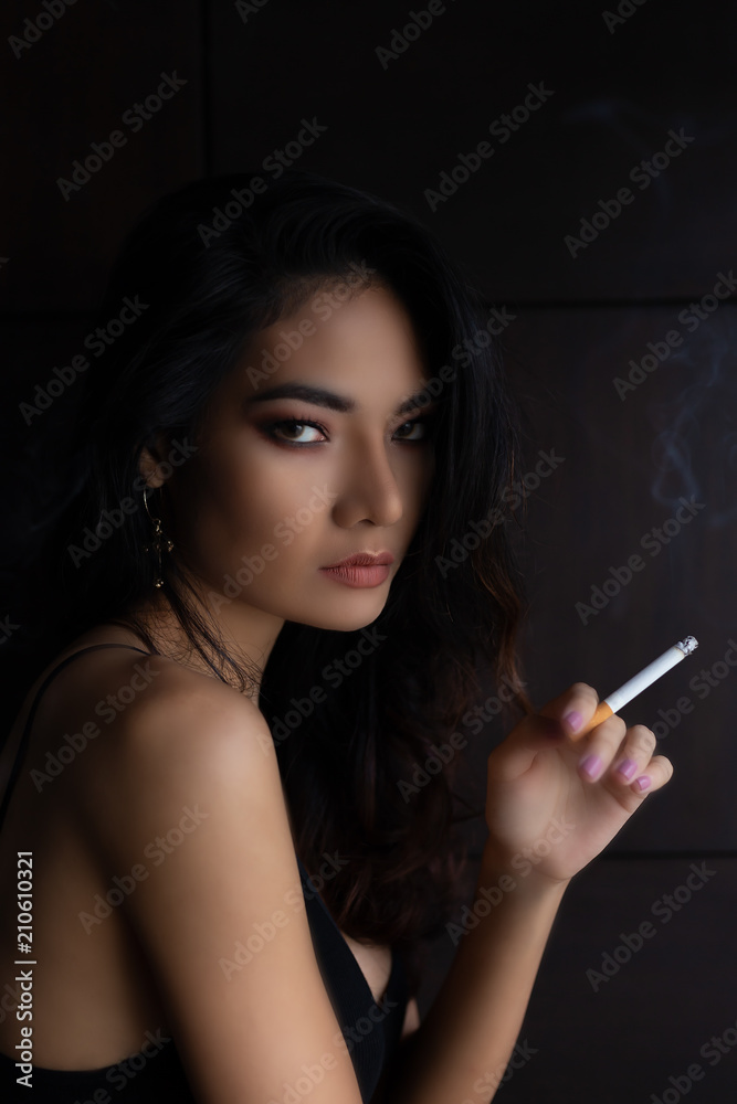 Portrait charming beautiful confident woman. Attractive beautiful sexy women  holds, smoke cigarette. Gorgeous woman has beautiful face and nice skin.  Beautiful asian woman gets successful of business Stock Photo | Adobe Stock