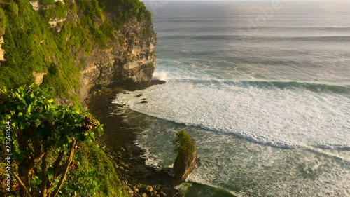 View on big ocean waves at the Uluwatu Temple, Pura Luhur Uluwatu, at the Bali island, Indonesia photo