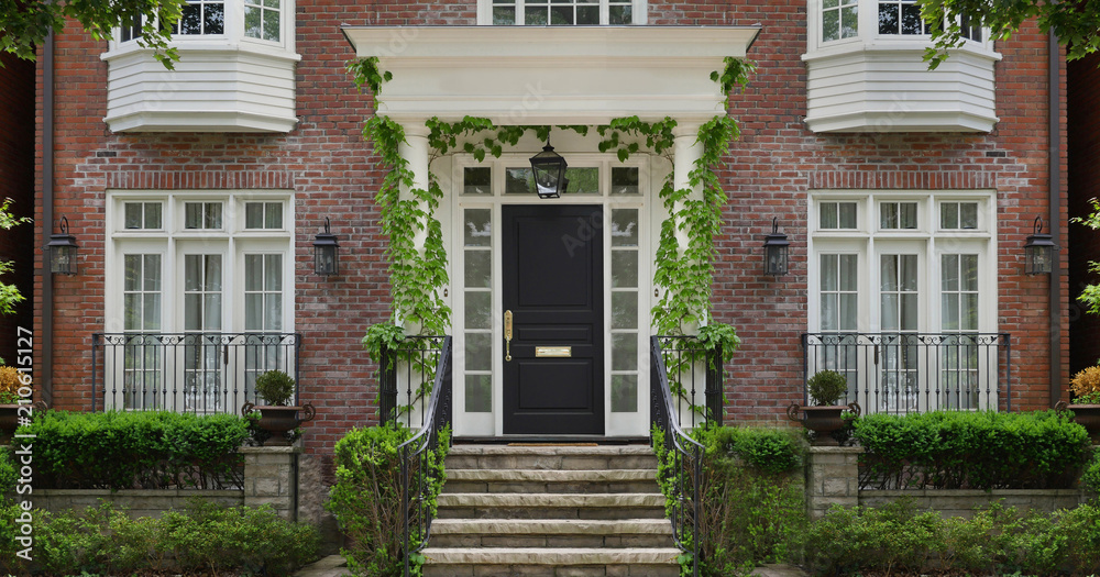 Obraz premium front door of house with vines around porch