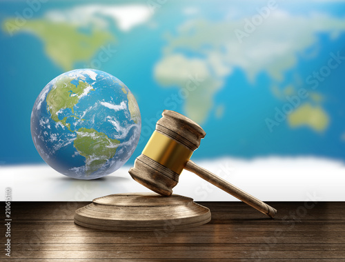 Fotografie world map planet earth globe and wooden judge gavel 3d-illustration