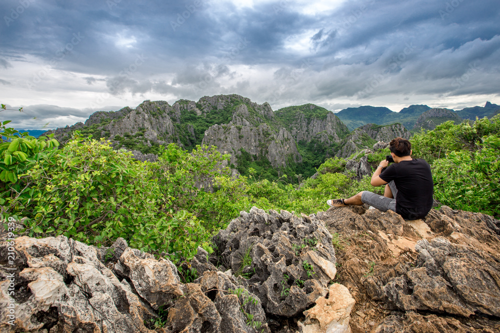 Male travelers The beauty of the surrounding (Khao Daeng viewpoint), which is located in Prachuap Khiri Khan, Thailand, is a tourist attraction to visit the beauty of the journey.