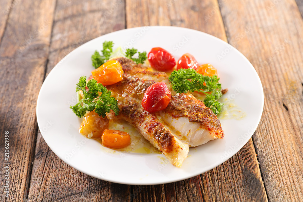 fish cooked with tomato and sauce fish cooked with tomato and sauce