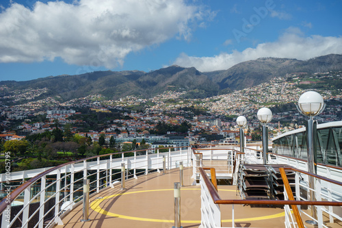 View of Madeira Island from the cruise ship with deck foregraund photo