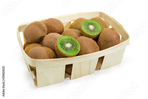 Kiwifruits in wooden basket on a white background