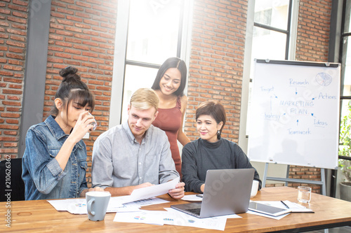 Group of diverse business people working together at modern office. Coworking concept. photo