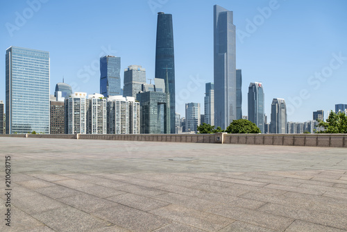 Urban skyscrapers with empty square floor tiles