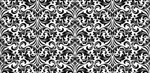 Wallpaper in the style of Baroque. Seamless vector background. White and black floral ornament. Graphic pattern for fabric, wallpaper, packaging. Ornate Damask flower ornament