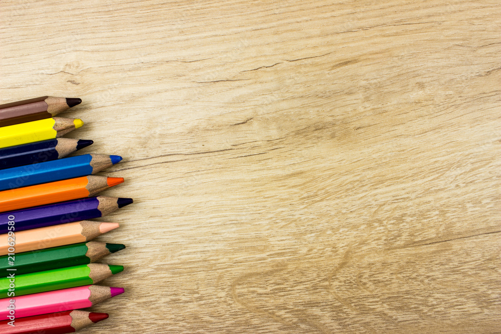 Color pencils set on wooden table Color pencils set on wooden table