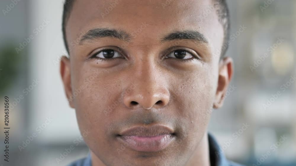 Serious Young African Man Face Looking at Camera Serious Young African Man Face Looking at Camera
