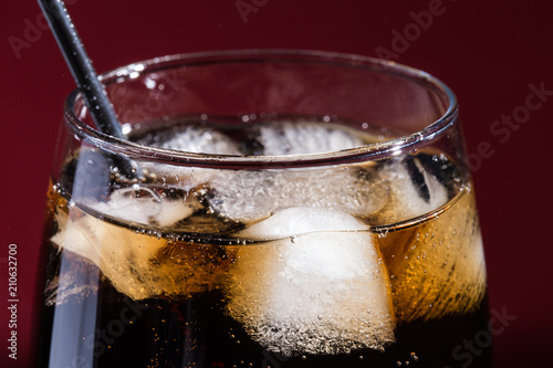 Wallpaper Mural A glass of cola beverage with a salt. On a red background. Torontodigital.ca