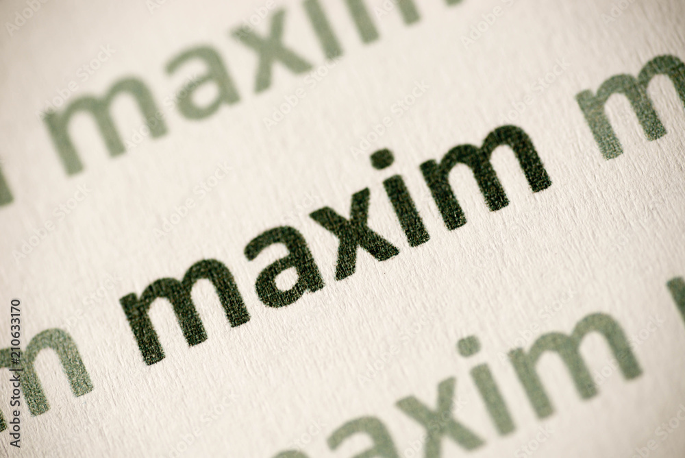 word maxim printed on paper macro word maxim printed on paper macro