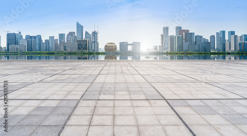 empty marble floor and cityscape of in blue cloud sky