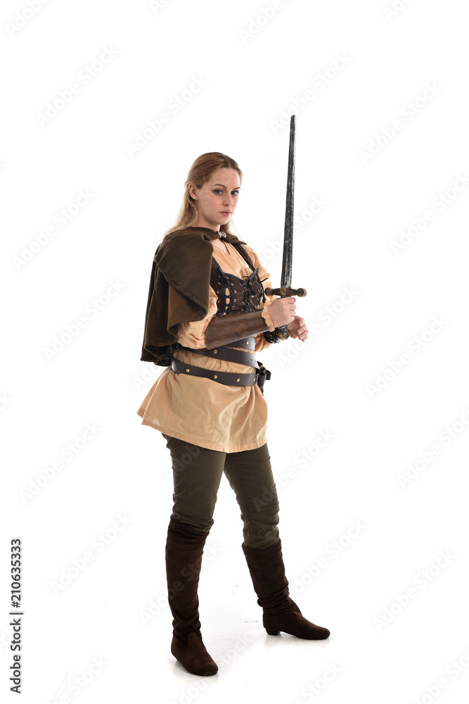 full length portrait of girl wearing brown medieval costume,. standing pose, isolated on white studio background. full length portrait of girl wearing brown medieval costume,. standing pose, isolated on white studio background.