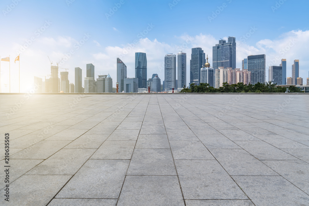 empty marble floor and cityscape of  in blue cloud sky