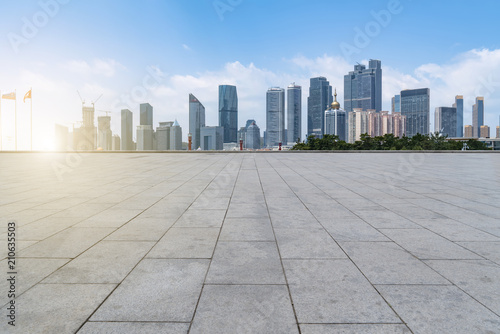empty marble floor and cityscape of in blue cloud sky
