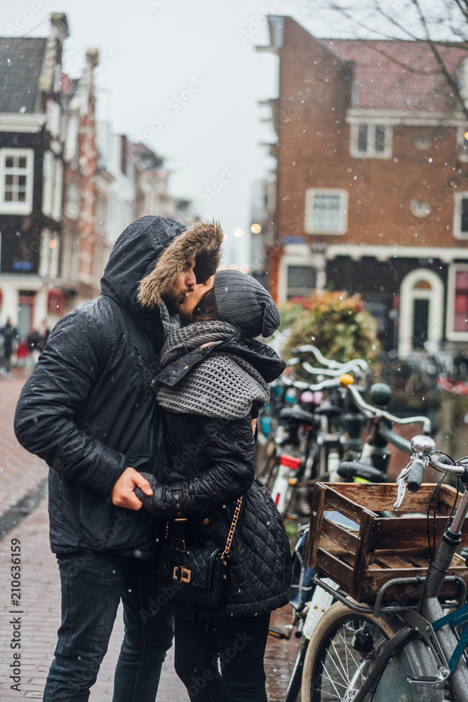 guy and girl in the street in the rain