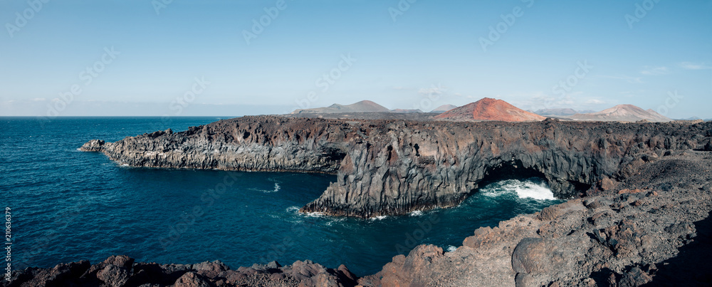 Panorama landscape of unique lava's caves and ocean