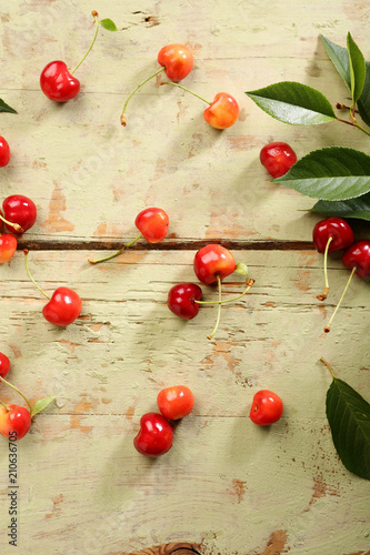 Cherries on a rustic green table