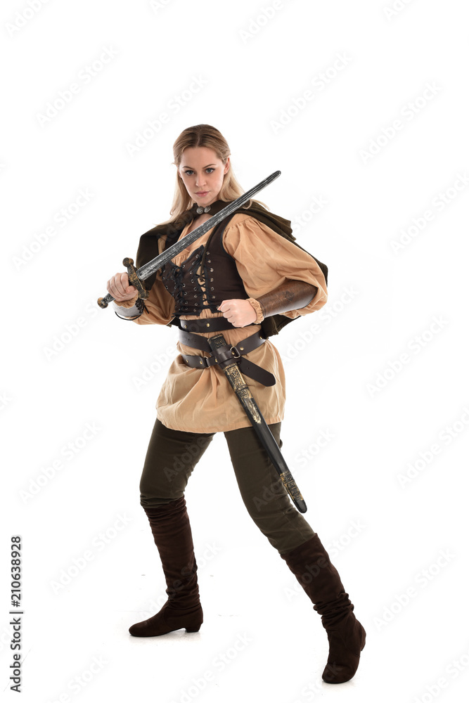 full length portrait of girl wearing brown medieval costume,. standing pose, isolated on white studio background. full length portrait of girl wearing brown medieval costume,. standing pose, isolated on white studio background.