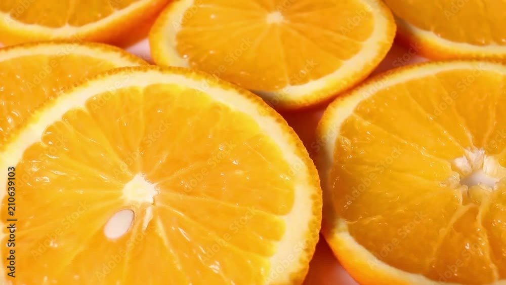 Oranges. Orange slices rotating pattern macro texture background backdrop footage video. Oranges. Orange slices rotating pattern macro texture background backdrop footage video.
