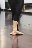 Ballerina dancing, closeup on legs and shoes.