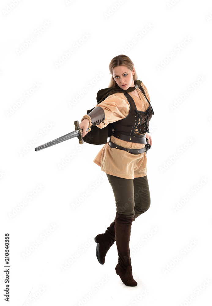 full length portrait of girl wearing brown medieval costume,. standing pose, isolated on white studio background. full length portrait of girl wearing brown medieval costume,. standing pose, isolated on white studio background.