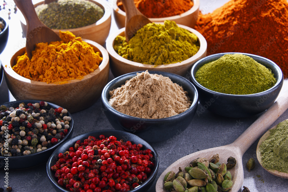 Variety of spices on kitchen table Variety of spices on kitchen table