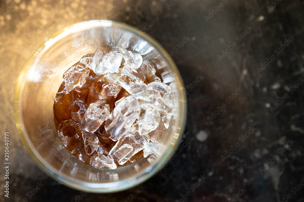 top up view of ice cube in cola glass drink top up view of ice cube in cola glass drink