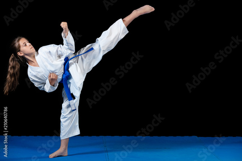 young girl in a white kimono, karate