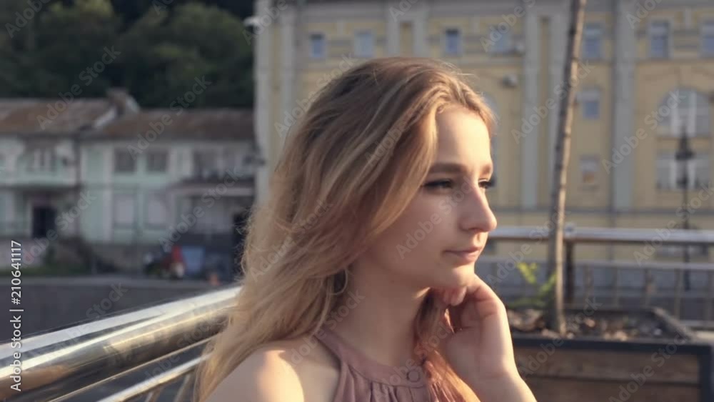 Portrait of woman posing to camera.