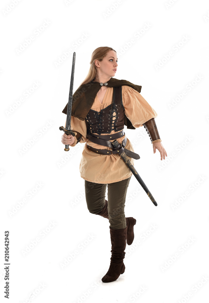 full length portrait of girl wearing brown medieval costume,. standing pose, isolated on white studio background. full length portrait of girl wearing brown medieval costume,. standing pose, isolated on white studio background.