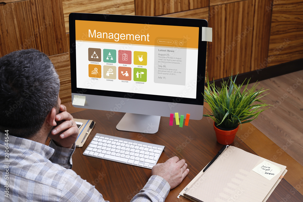 Man using computer with Management concept on screen Man using computer with Management concept on screen