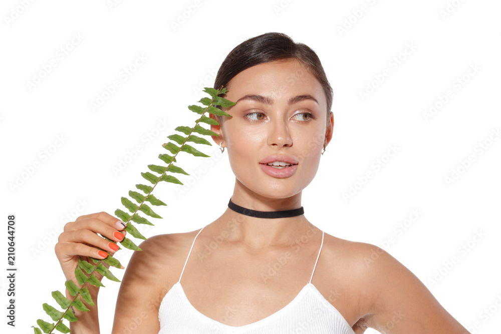 model with natural make up and green leaf isolated on white. Spa and wellness. model with natural make up and green leaf isolated on white. Spa and wellness.