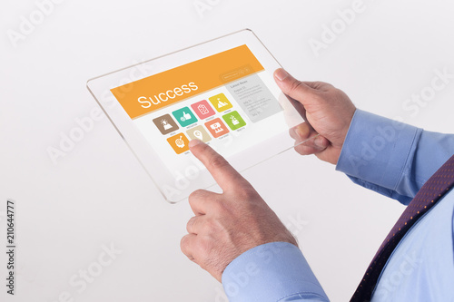 Hand Holding Transparent Tablet PC with Success screen