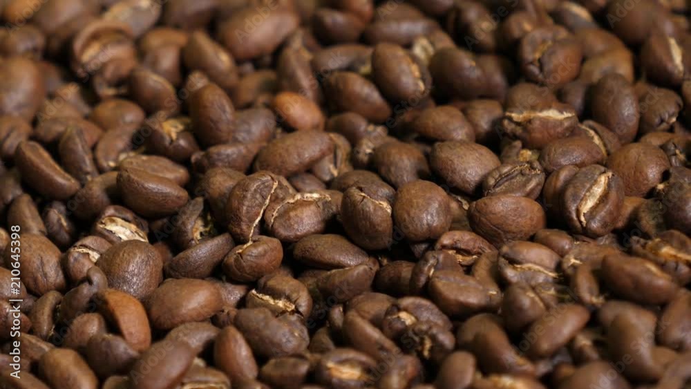Coffee roaster working process - after the roasting oven beans are mixing on cooling surface Coffee roaster working process - after the roasting oven beans are mixing on cooling surface