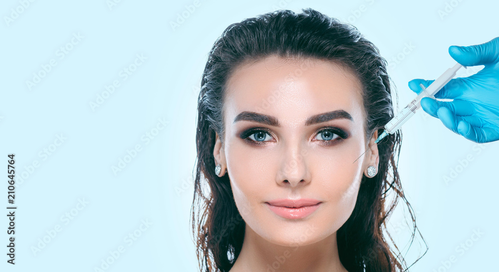 Fototapeta premium injections, cosmetology, beautiful female face with perfect skin