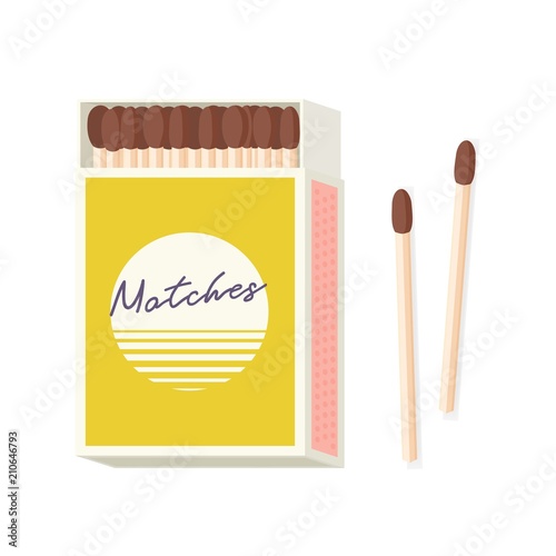 Matchbox and pair of wooden matches lying beside it isolated on white background