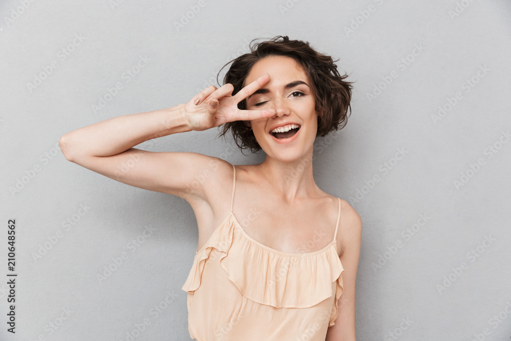 Fototapeta premium Portrait of a cheerful young woman