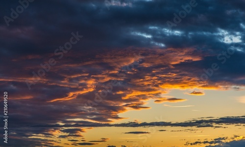 Dramatic sky at sunset with clouds