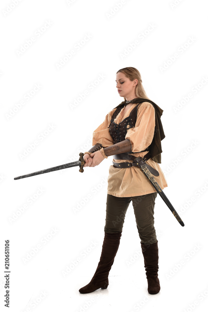 full length portrait of girl wearing brown medieval costume,. standing pose, isolated on white studio background. full length portrait of girl wearing brown medieval costume,. standing pose, isolated on white studio background.
